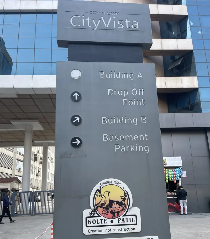 City Vista direction sign pointing to Building A, Building B and basement parking